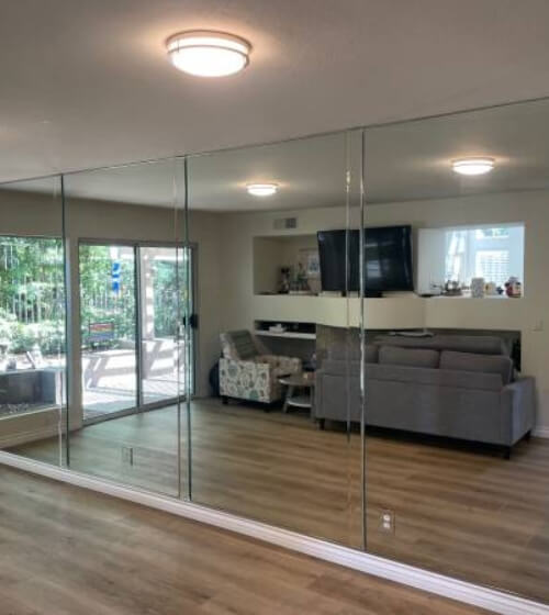 custom mirror floor-to-ceiling panels in living room